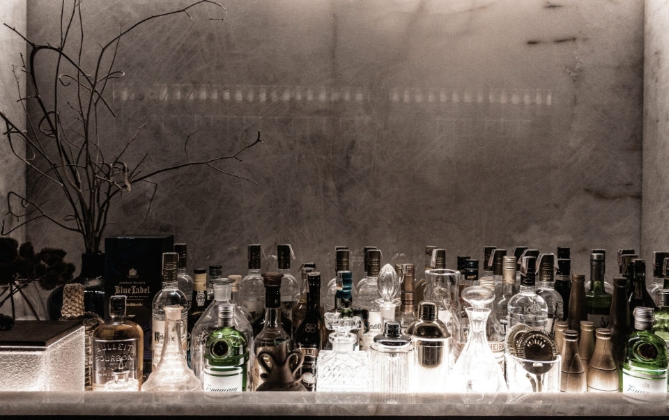 elegant bottles sitting on a bar